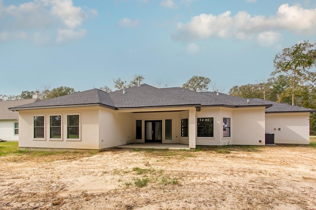 79 Rd 6606, Dayton, TX 77535 - rear view of house with a patio, stucco siding, and central AC unit