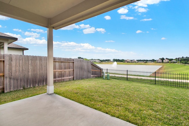 18331 Yaupon Bough Ln, Tomball, TX 77377 - view of yard featuring a patio, a water view, and a fenced backyard