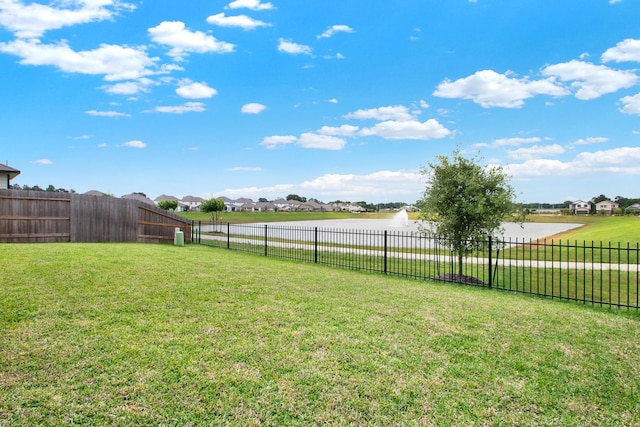 18331 Yaupon Bough Ln, Tomball, TX 77377 - view of yard with a water view, a fenced backyard, and a residential view