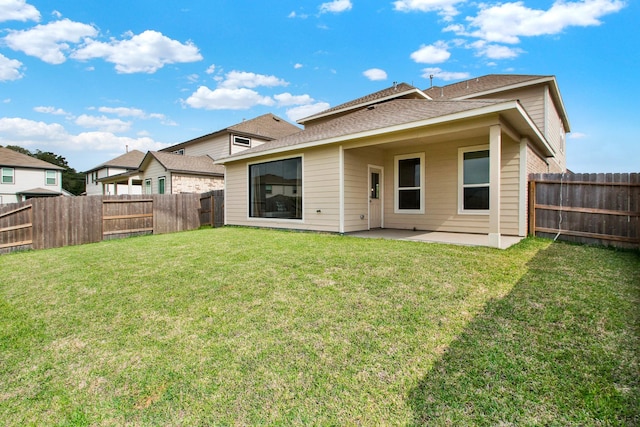 18331 Yaupon Bough Ln, Tomball, TX 77377 - back of house with a fenced backyard, a lawn, a patio area, and roof with shingles