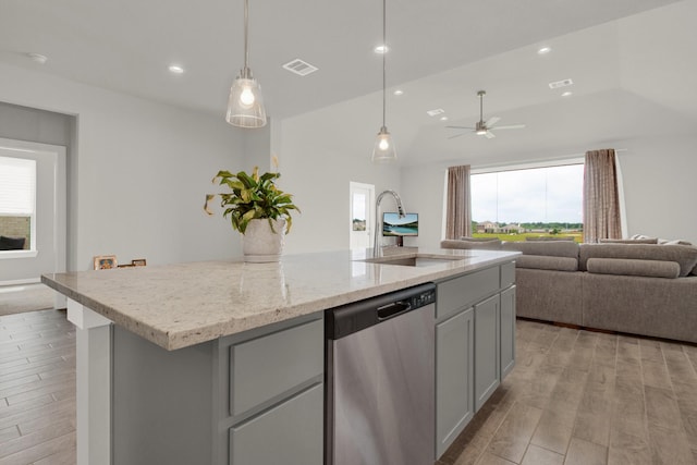18331 Yaupon Bough Ln, Tomball, TX 77377 - kitchen featuring open floor plan, lofted ceiling, light wood-type flooring, stainless steel dishwasher, and visible vents