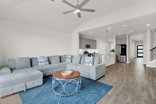18331 Yaupon Bough Ln, Tomball, TX 77377 - living area featuring a ceiling fan, light wood-type flooring, stairs, lofted ceiling, and recessed lighting