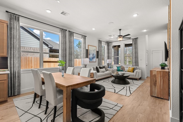 dining room featuring visible vents, recessed lighting, ceiling fan, and light wood-type flooring