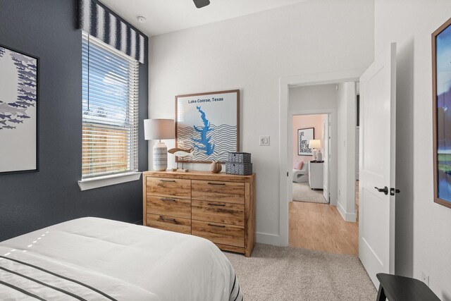 bedroom featuring carpet floors, a ceiling fan, and baseboards