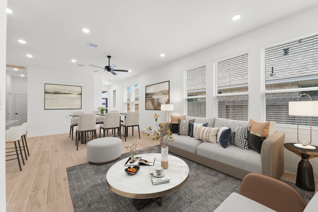 21517 Witham Promenade Ln, Magnolia, TX 77355 - living room with light wood finished floors, recessed lighting, a ceiling fan, and baseboards