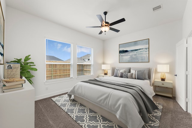 21517 Witham Promenade Ln, Magnolia, TX 77355 - bedroom with dark carpet, baseboards, and a ceiling fan