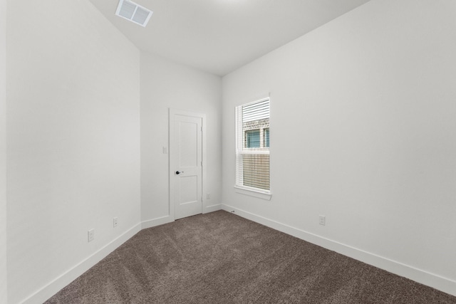 21517 Witham Promenade Ln, Magnolia, TX 77355 - spare room with dark colored carpet and baseboards