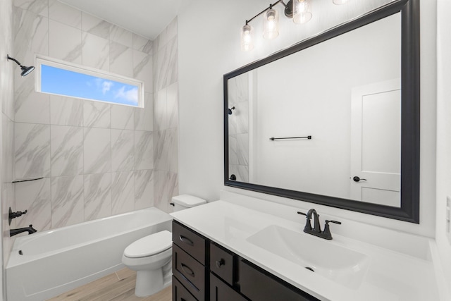 21517 Witham Promenade Ln, Magnolia, TX 77355 - bathroom with toilet, vanity, tub / shower combination, and wood finished floors