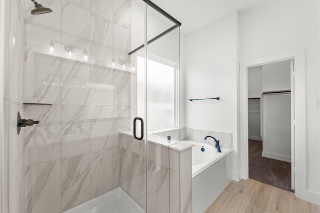 21517 Witham Promenade Ln, Magnolia, TX 77355 - full bath with a bath, a shower stall, and a walk in closet