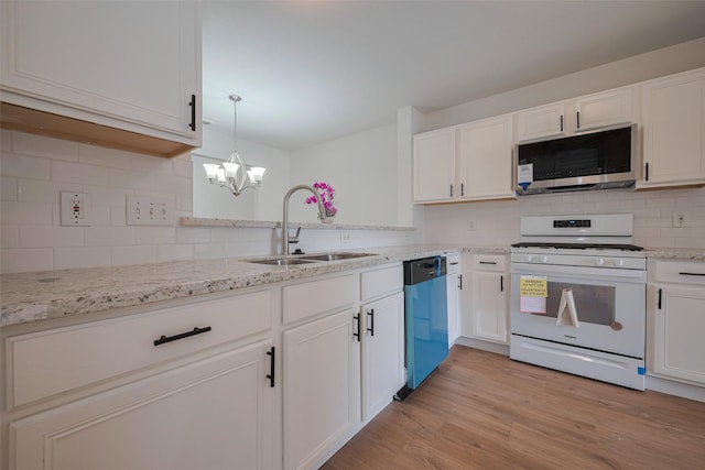 10918 Linden Gate Dr, Houston, TX 77075 - kitchen with white gas range, stainless steel microwave, a sink, dishwasher, and white cabinets