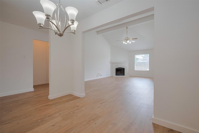 unfurnished living room featuring visible vents, light wood-style floors, a fireplace with raised hearth, ceiling fan with notable chandelier, and vaulted ceiling