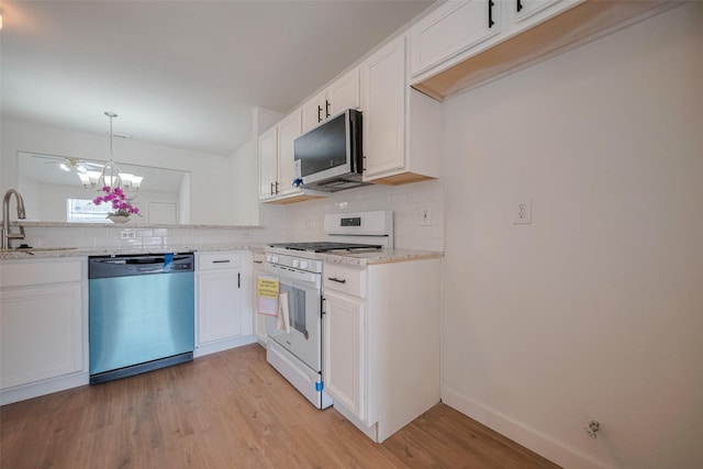 kitchen with decorative backsplash, stainless steel microwave, white range with gas cooktop, and dishwashing machine
