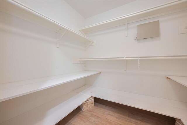 spacious closet with wood finished floors