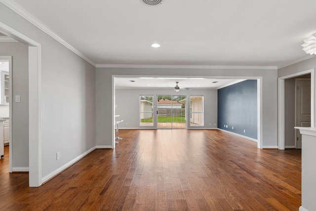 unfurnished living room featuring baseboards, ornamental molding, ceiling fan, and wood finished floors