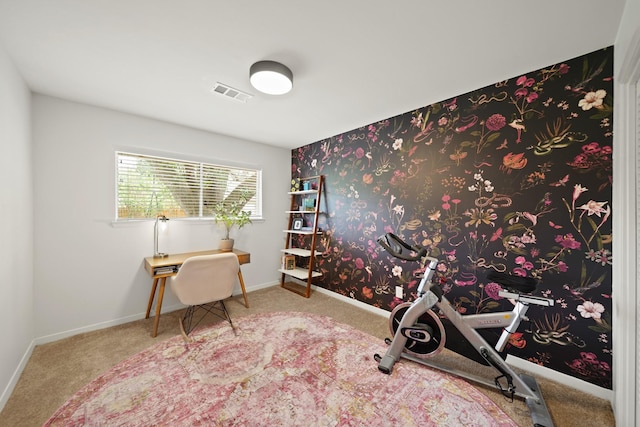 carpeted home office featuring visible vents and baseboards