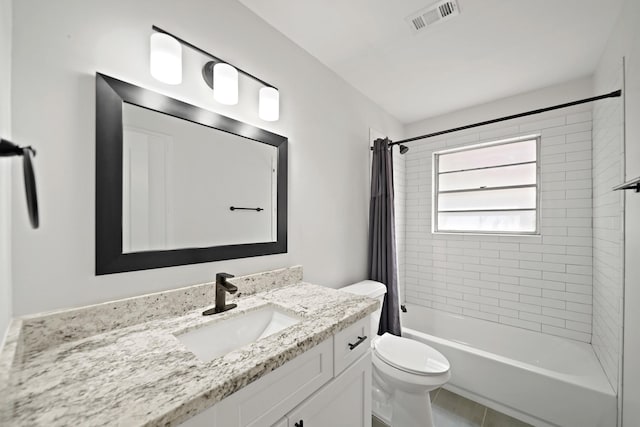 full bathroom featuring visible vents, shower / tub combo, toilet, and vanity