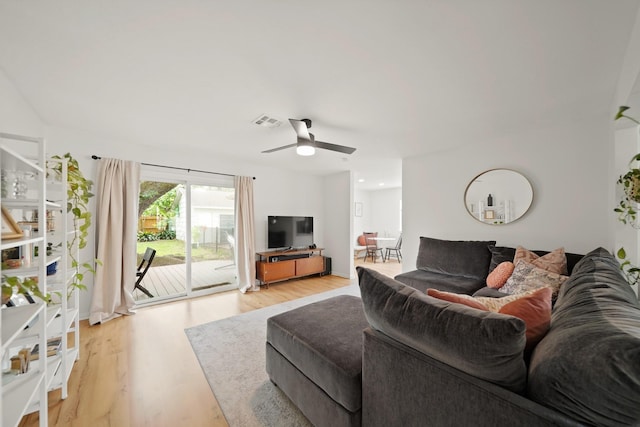 living area with visible vents, ceiling fan, and light wood-type flooring