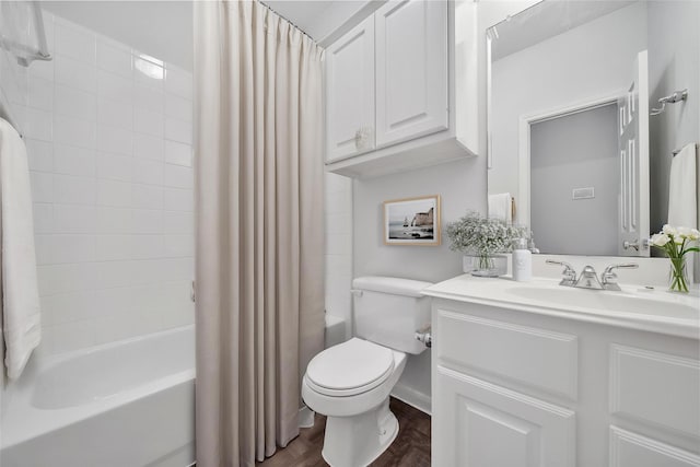 bathroom featuring vanity, wood finished floors, shower / bath combo, and toilet