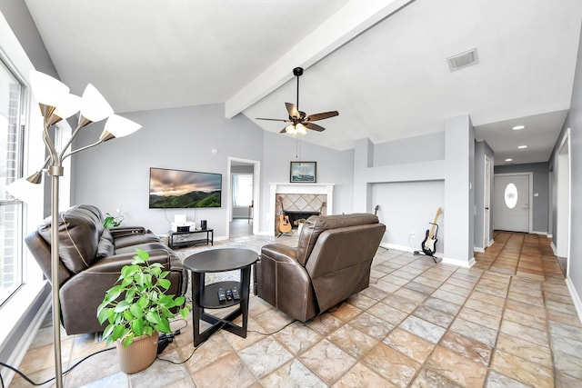 6102 Ghana Ln, Pasadena, TX 77505 - living area featuring a ceiling fan, a tiled fireplace, baseboards, and plenty of natural light