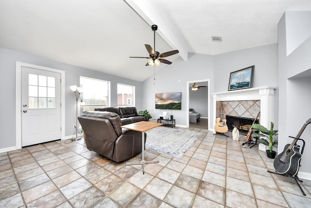 6102 Ghana Ln, Pasadena, TX 77505 - living room with plenty of natural light, a ceiling fan, a tiled fireplace, and baseboards