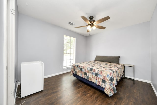 6102 Ghana Ln, Pasadena, TX 77505 - bedroom featuring baseboards, wood finished floors, and a ceiling fan