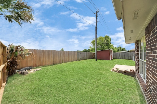 6102 Ghana Ln, Pasadena, TX 77505 - view of yard featuring a storage unit and an outdoor structure