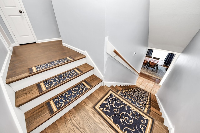 6102 Ghana Ln, Pasadena, TX 77505 - staircase with wood finished floors and baseboards