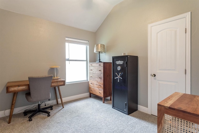 carpeted home office with baseboards and lofted ceiling