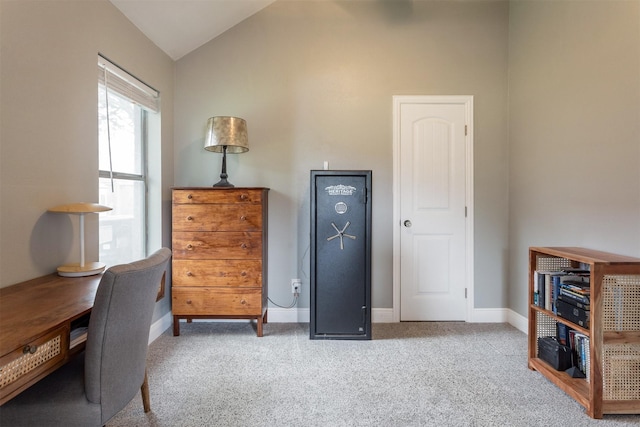 office area featuring baseboards, carpet, and lofted ceiling