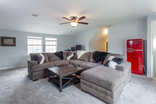 living area featuring carpet floors, ceiling fan, baseboards, and visible vents