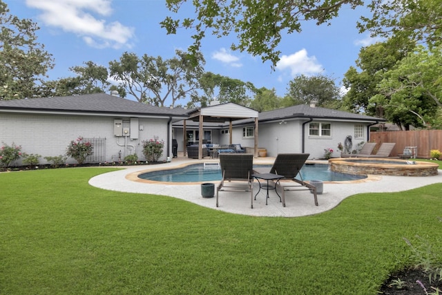 back of house with a fenced in pool, an in ground hot tub, a yard, and brick siding