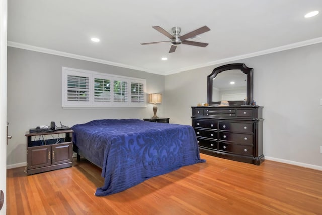 bedroom featuring crown molding, recessed lighting, baseboards, and wood finished floors