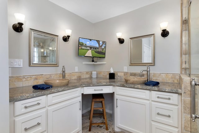 bathroom with double vanity and a sink