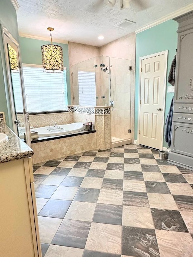 18606 Spring Heather Ct, Spring, TX 77379 - bathroom with a bath, a stall shower, a textured ceiling, vanity, and crown molding