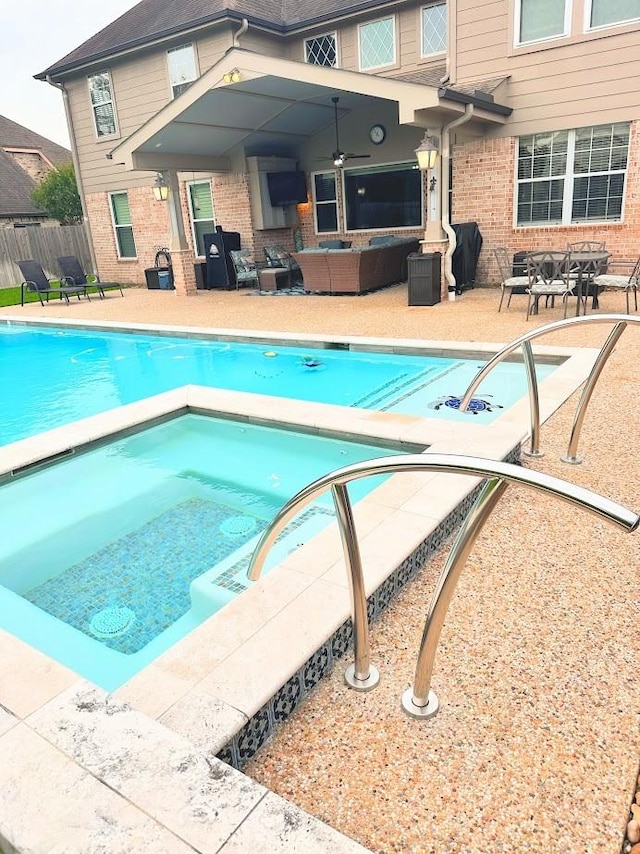 view of pool with fence, a patio, an outdoor hangout area, a fenced in pool, and an in ground hot tub