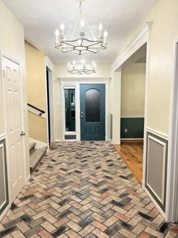 18606 Spring Heather Ct, Spring, TX 77379 - entrance foyer with a chandelier, stairs, and brick flooring