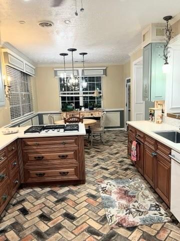 18606 Spring Heather Ct, Spring, TX 77379 - kitchen featuring brick floors, light countertops, dishwasher, and decorative light fixtures