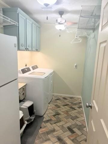18606 Spring Heather Ct, Spring, TX 77379 - laundry area featuring washer and clothes dryer, cabinet space, brick floors, and baseboards