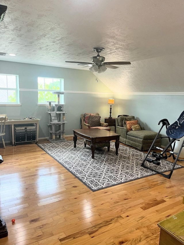 18606 Spring Heather Ct, Spring, TX 77379 - living room with a textured ceiling, a ceiling fan, wood finished floors, and baseboards