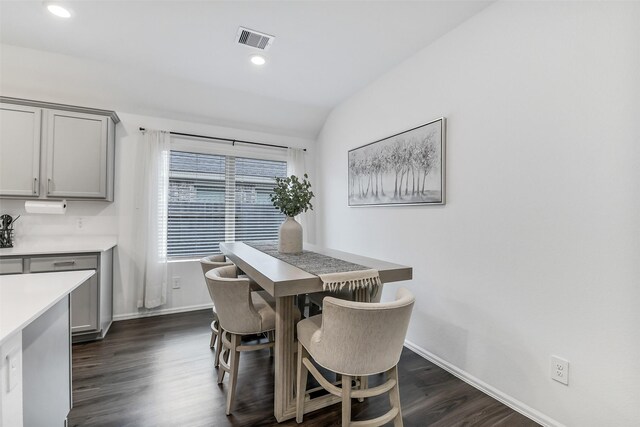 dining space with visible vents, recessed lighting, dark wood finished floors, and baseboards