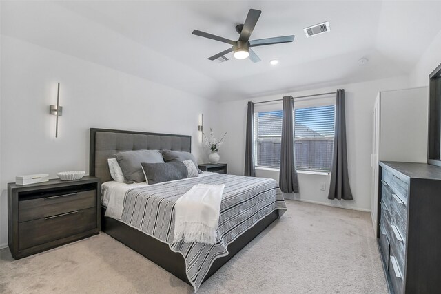 bedroom featuring a ceiling fan, baseboards, visible vents, and light carpet