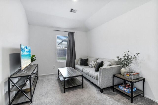 carpeted living area with baseboards and visible vents