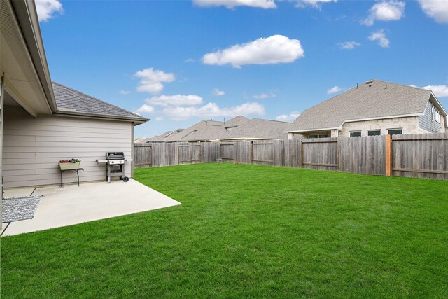 view of yard with a fenced backyard and a patio area