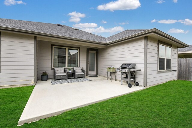 rear view of property featuring fence, roof with shingles, an outdoor hangout area, a lawn, and a patio