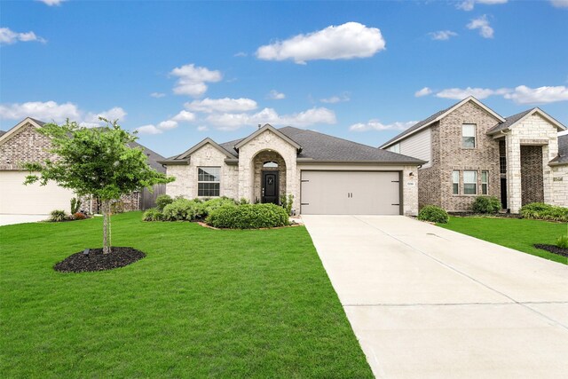 view of front of property featuring concrete driveway, brick siding, a garage, and a front lawn