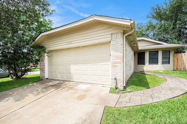 16226 Alden Ridge Dr, Houston, TX 77053 - view of front of house with an attached garage, fence, and driveway