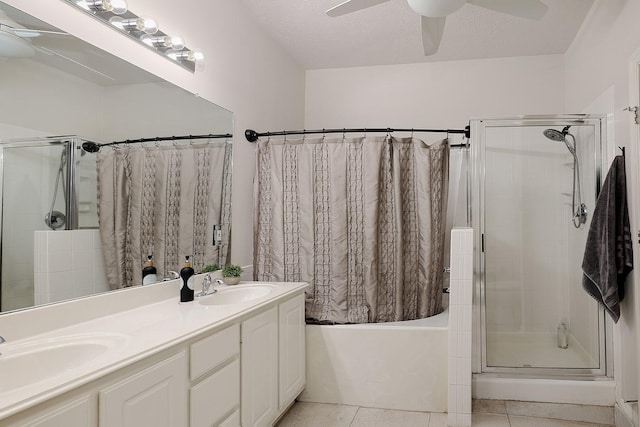bathroom featuring double vanity, a ceiling fan, tile patterned floors, and a sink
