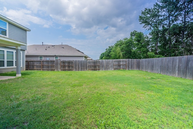 view of yard with a fenced backyard
