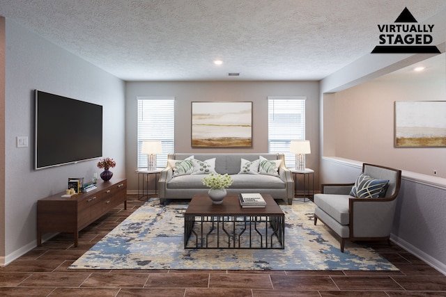 4219 Mossy Banks Ln, Houston, TX 77068 - living room with healthy amount of natural light, baseboards, a textured ceiling, and recessed lighting