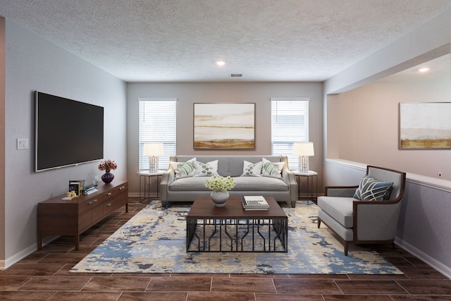 4219 Mossy Banks Ln, Houston, TX 77068 - living room with healthy amount of natural light, baseboards, wood tiled floors, a textured ceiling, and recessed lighting
